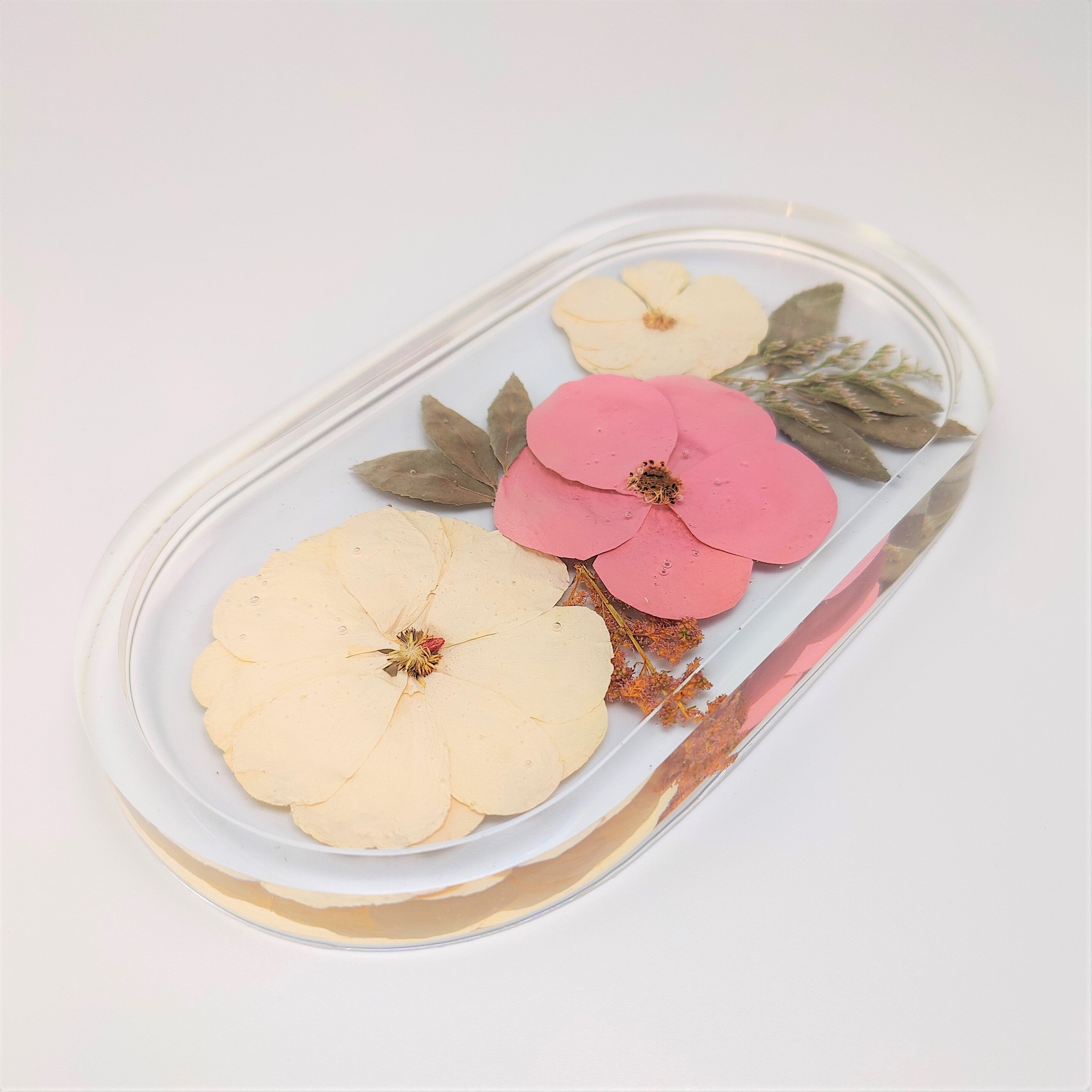 Pill shape floral trinket dish in resin - a flower preservation art